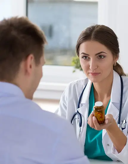 Doctor providing medication guidance during a one-on-one patient consultation.